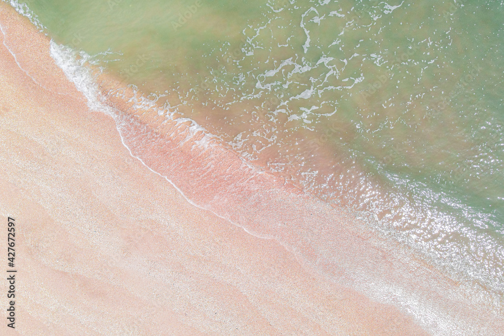 Fototapeta premium Aerial view of Atlantic ocean with pink sand beach 