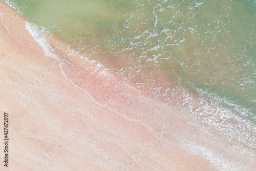 Aerial view of Atlantic ocean with pink sand beach 