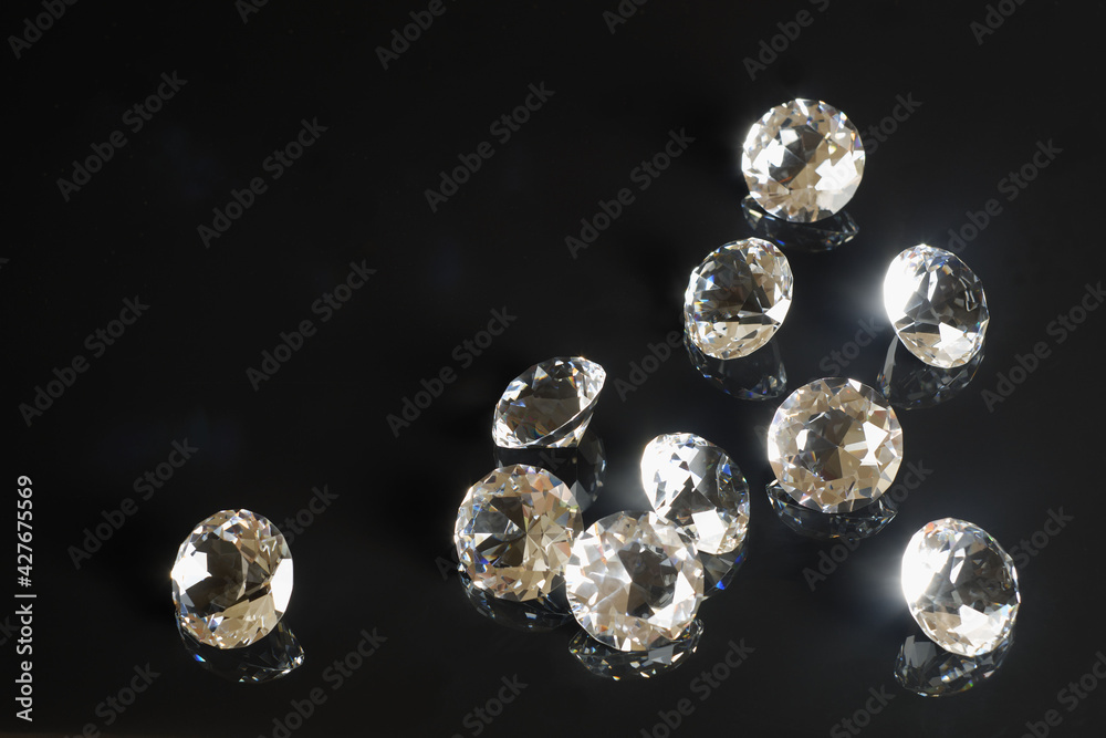 Several excellent pure diamonds with reflection on black mirror background close up view. Jewelry diamonds sale, invitation, action, discount banner, poster, card template copy space Several excellent pure diamonds with reflection on black mirror background close up view. Jewelry diamonds sale, invitation, action, discount banner, poster, card template copy space
