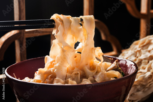 A bowl of noodles with braised beef photo