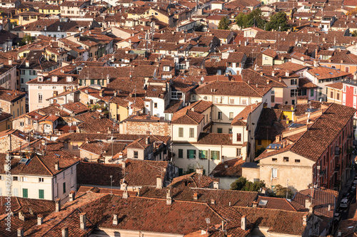 Top view of old roofs with tiles, historic part of the city of Brescia, Italy