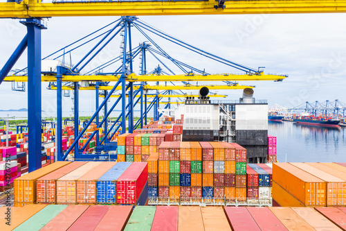 ear view cargo container ship. Business logistic transportation sea freight, Cargo container in deep sea port at industrial, Cargo ship, Crane And Unloading Containers