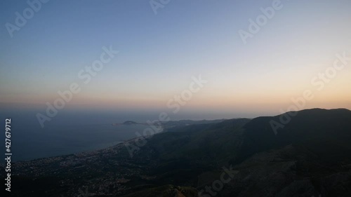 sunset on the Redentore mount over the gulf of Gaeta. Aurunci Mountains, Formia, Latina, Lazio, Italy photo