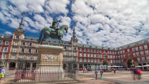 Statue of Philip III timelapse hyperlapse at Mayor plaza in Madrid in a beautiful summer day with cloudy sky, Spain photo