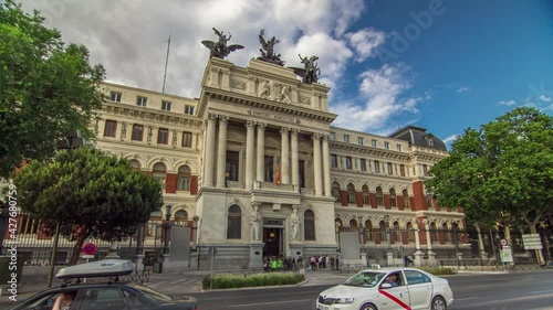 Government palace facade the Ministry of Agriculture building (Ministerio de Agricultura) timelapse hyperlapse with traffic. Placed close to the Atocha railway station in Madrid, Spain.