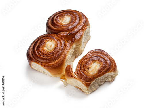 Three buns with a golden crust and cottage cheese filling on white