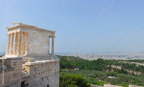 Ruins of Propylaea, the monumental gateway that serves as the entrance to the Acropolis of Athens ruins, famous tourist attraction in Greece, in sunny summer day