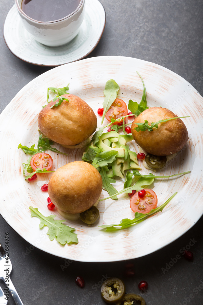 Middle eaterns fried donuts served with avocado Middle eaterns fried donuts served with avocado