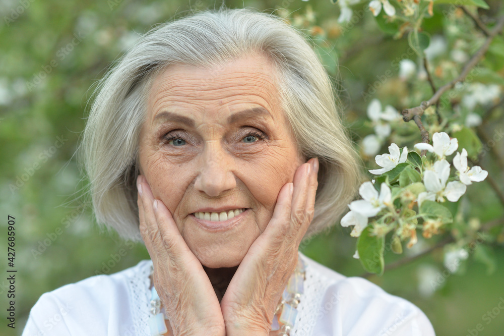 happy senior beautiful woman in spring park happy senior beautiful woman in spring park