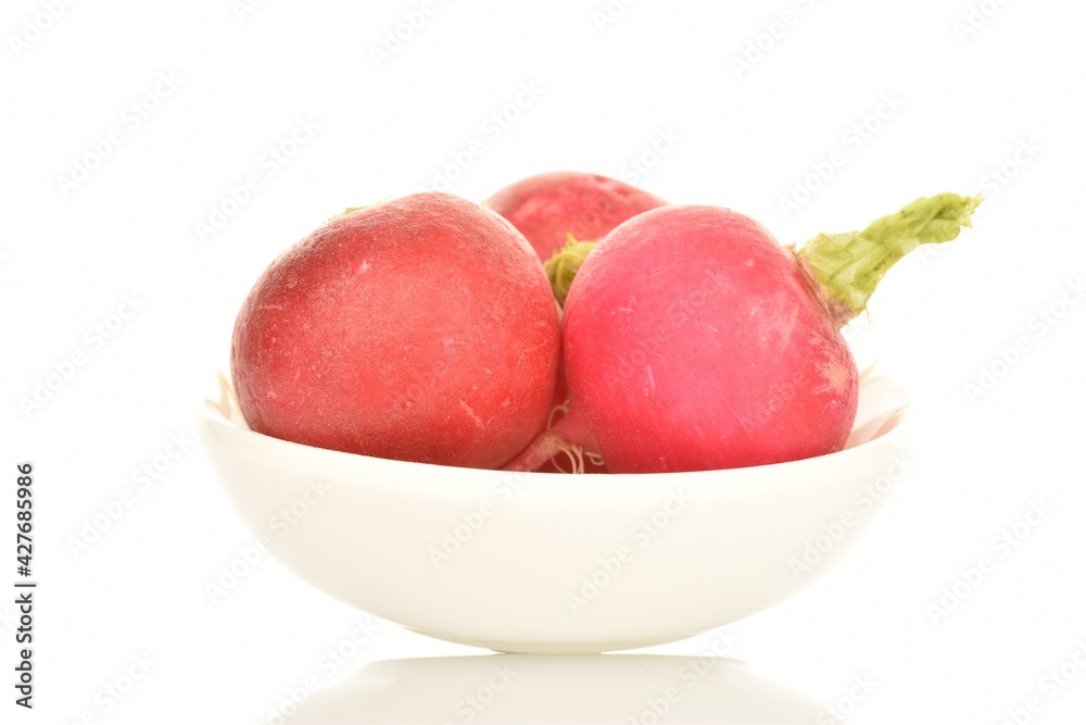 Fresh peeled ripe radish with a ceramic plate, close-up, isolated on white. Fresh peeled ripe radish with a ceramic plate, close-up, isolated on white.