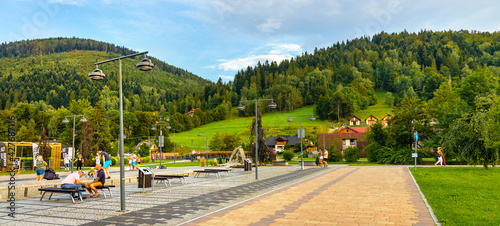 Fototapeta Naklejka Na Ścianę i Meble -  Panoramic view of St. Jacob square, plac Sw. Jakuba, in Szczyrk mountain resort of Beskidy Mountains in Silesia region of Poland