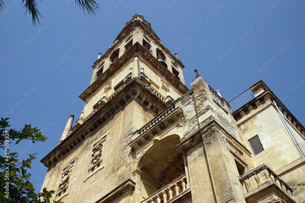 Bell tower of Mezquita, Mosque-Cathedral against clear blue sky, Cordoba. Andalusia, Spain.