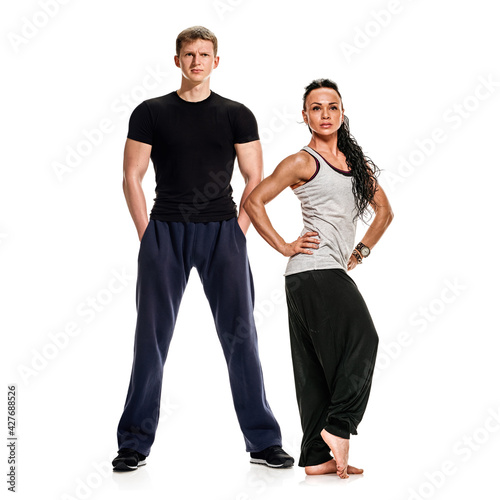 Full photo of fit pretty man and woman posing in sportswear and smiling at camera, spending time together, motivation