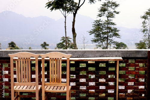 Artistic wooden couple chair with table