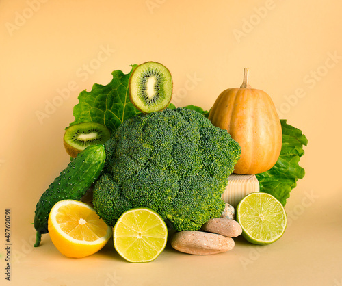 Fototapeta Naklejka Na Ścianę i Meble -  Fresh green vegetables and fruits on a pastel background. Food balance, Equilibrium.Copy space.