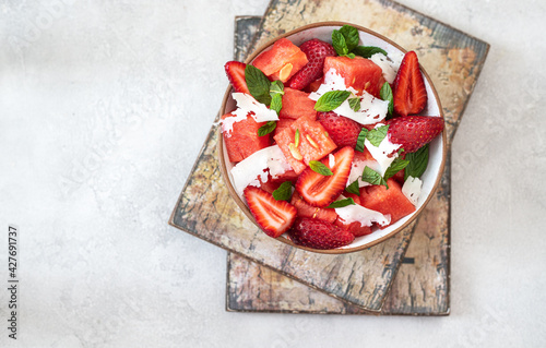 Watermelon salad with strawberries, mint and cheese