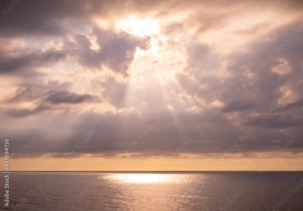 Sun hidden in the Mediterranean sea.