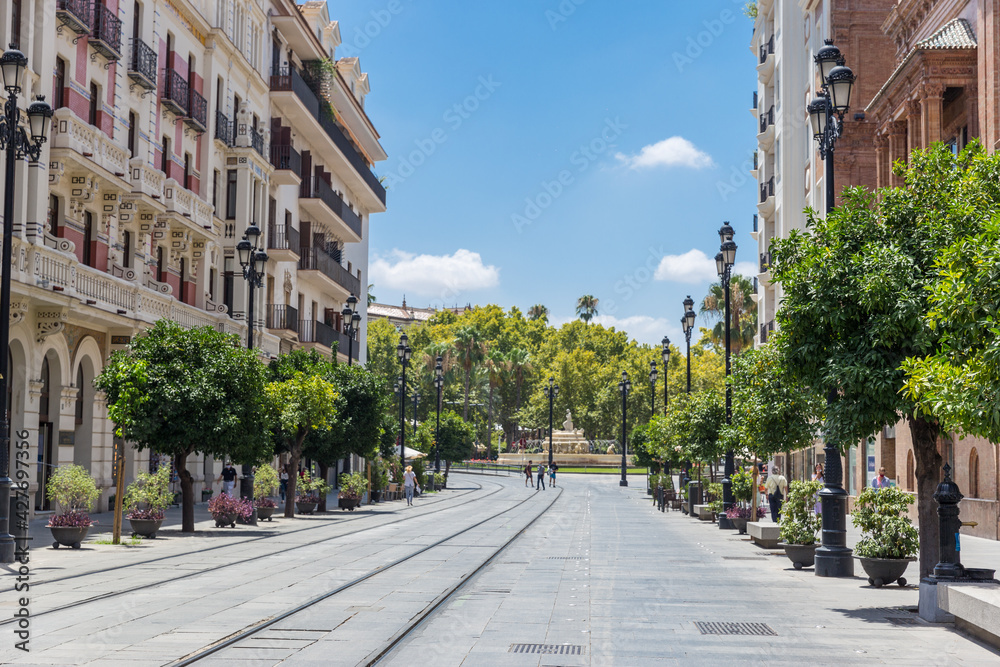 Beautiful city center of Seville with few tourist due the Coronavirus isolation measures. Tram rails, trams at the station.