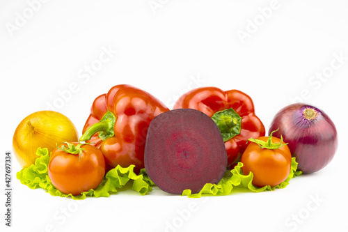An assortment  of vegetables is isolated on a white background.