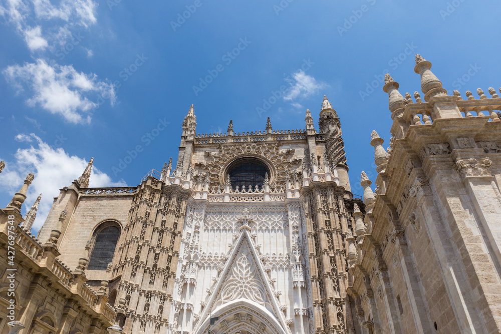 View of the beautiful facade and architecture of the Cathedral of Seville. Roman Catholic cathedral registered in 1987 by UNESCO as a World Heritage SiteThe third-largest church in the world.