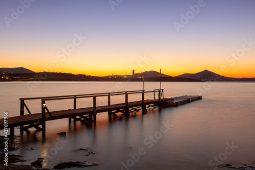 An old wooden platform as scenery of the sunset at a beach in Paros island  Cyclades islands  Aegean Sea  Greece  Europe.