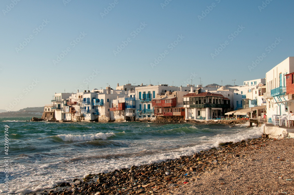 Panoramic view of traditional beachfront houses in the village on the island of Mykonos in Greece. Concept Travel Tourism
