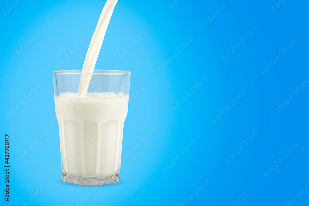 Glass of milk on the blue background. Glass of milk on the blue background.