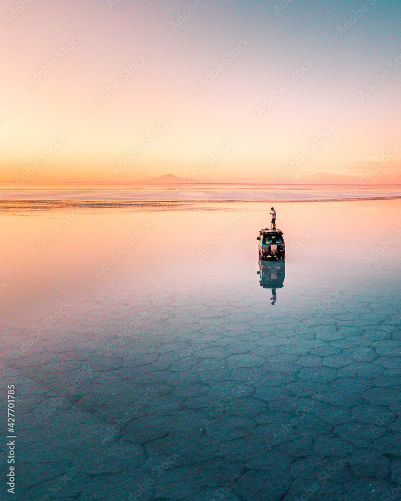 Aerial view of the Uyuni salt flat, reflection in sunset