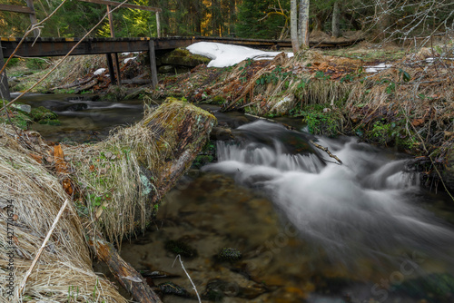 Uhlava river near Spicak hill with wooden bridge and spring fresh water photo