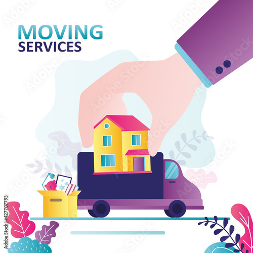 Truck transports household items and furniture to new home. Hand puts house on van