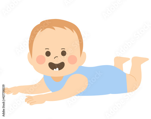 Cute baby boy smiling showing first teeth on tummy time pose