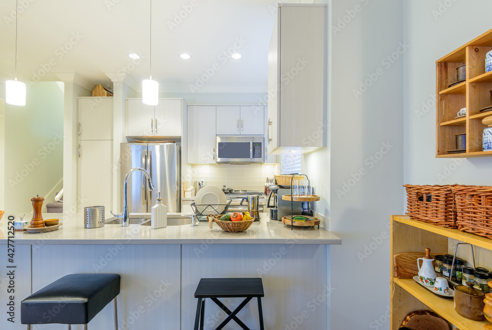 Modern, bright, clean, kitchen interior with stainless steel appliances in a luxury house Modern, bright, clean, kitchen interior with stainless steel appliances in a luxury house
