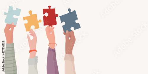 Banner. Autism syndrome concept. Group of raised arms of diverse people holding a jigsaw piece. Learning support and education. Neurological Disease. Mind and brain. Conceptual