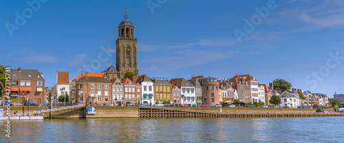 Deventer, The Netherlands - August 27 2016: Dutch city Deventer  skyline panorama view with the Great Church of Lebuines along side the IJssel river photo