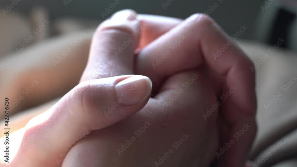Focus on a woman passenger crossed hands praying for safe flight Focus on a woman passenger crossed hands praying for safe flight