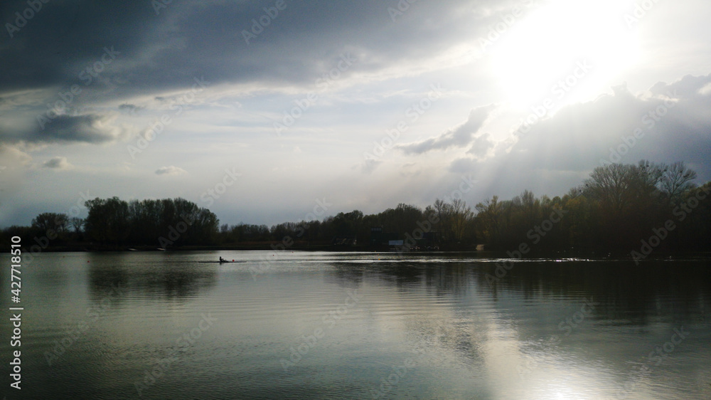 Kayaker on the water during the sunset, Zemnik, Bratislava, Slovakia Kayaker on the water during the sunset, Zemnik, Bratislava, Slovakia