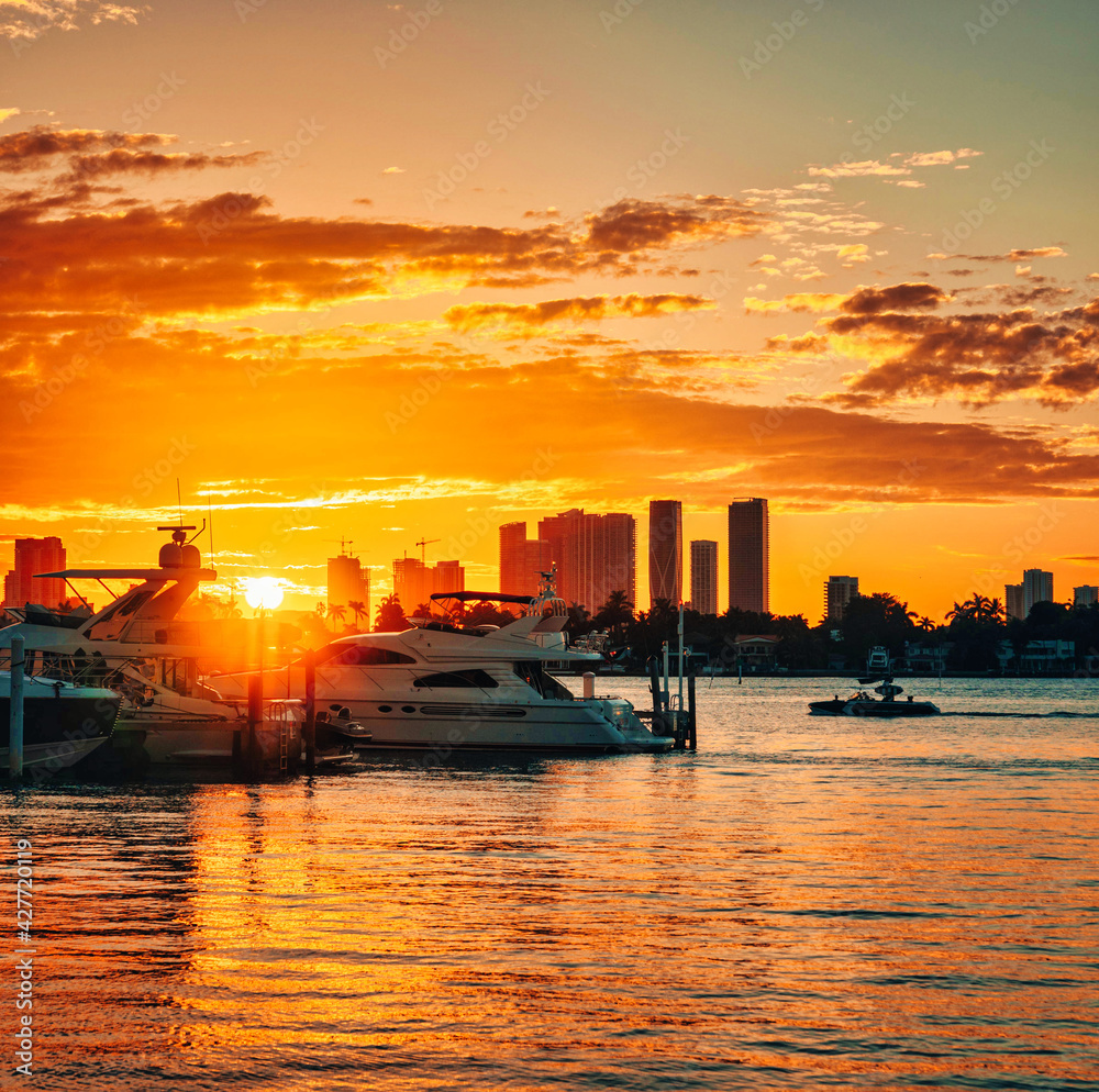 sunset over the river sea skyline miami sun summer florida beautiful boats buildings horizon 