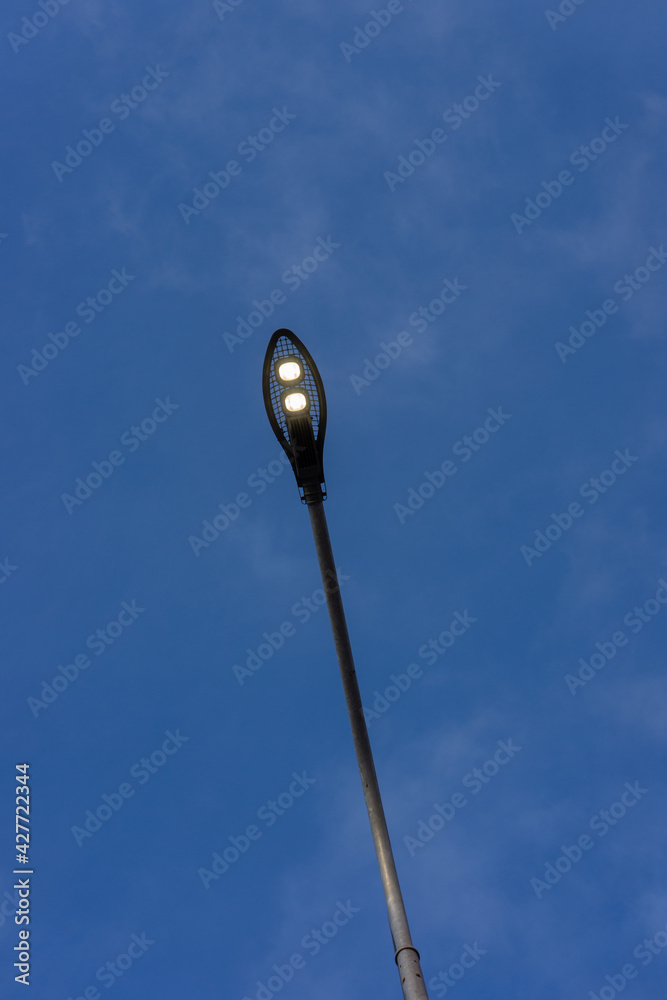 LED lighting of street lamps against the blue sky. LED lighting of street lamps against the blue sky.