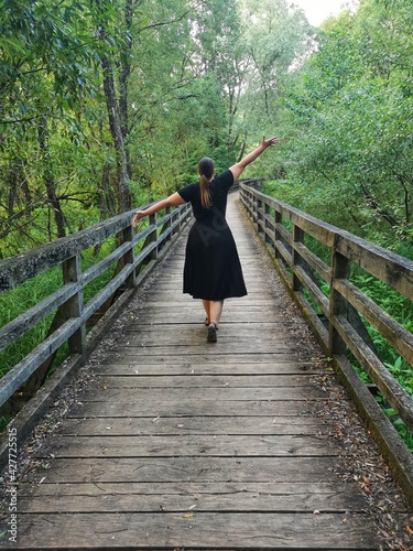 person walking on bridge