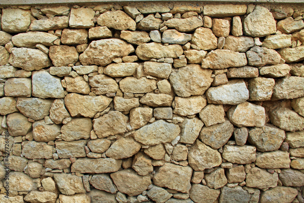 Stone background texture of a wall from The Palace of Knossos on Crete in Greece near Heraklion is called Europe’s oldest city and the ceremonial and political center of the Minoan civilization. Stone background texture of a wall from The Palace of Knossos on Crete in Greece near Heraklion is called Europe’s oldest city and the ceremonial and political center of the Minoan civilization.