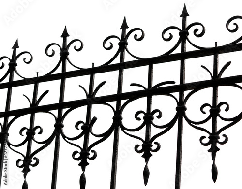 Black wrought iron front garden. Metal fence made of forged steel. Close up. Isolated on white background.