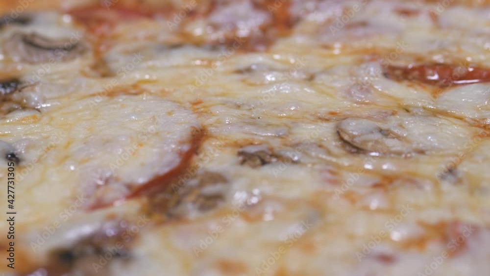 Large round pizza with a cheese side in a box. Large round pizza with a cheese side in a box.