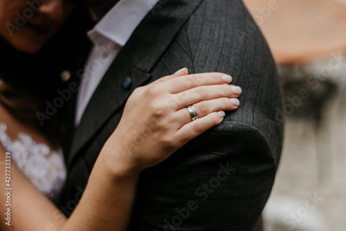 bride and groom holding hands rings wedding dress  © Mehmed