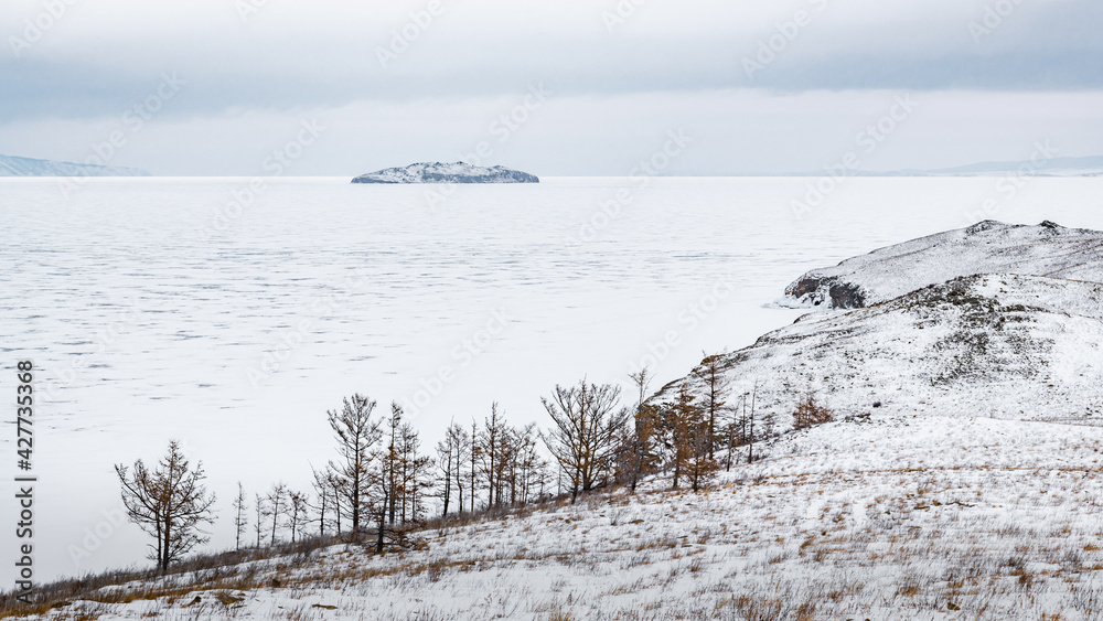 A small island in the ice of Lake Baikal A small island in the ice of Lake Baikal