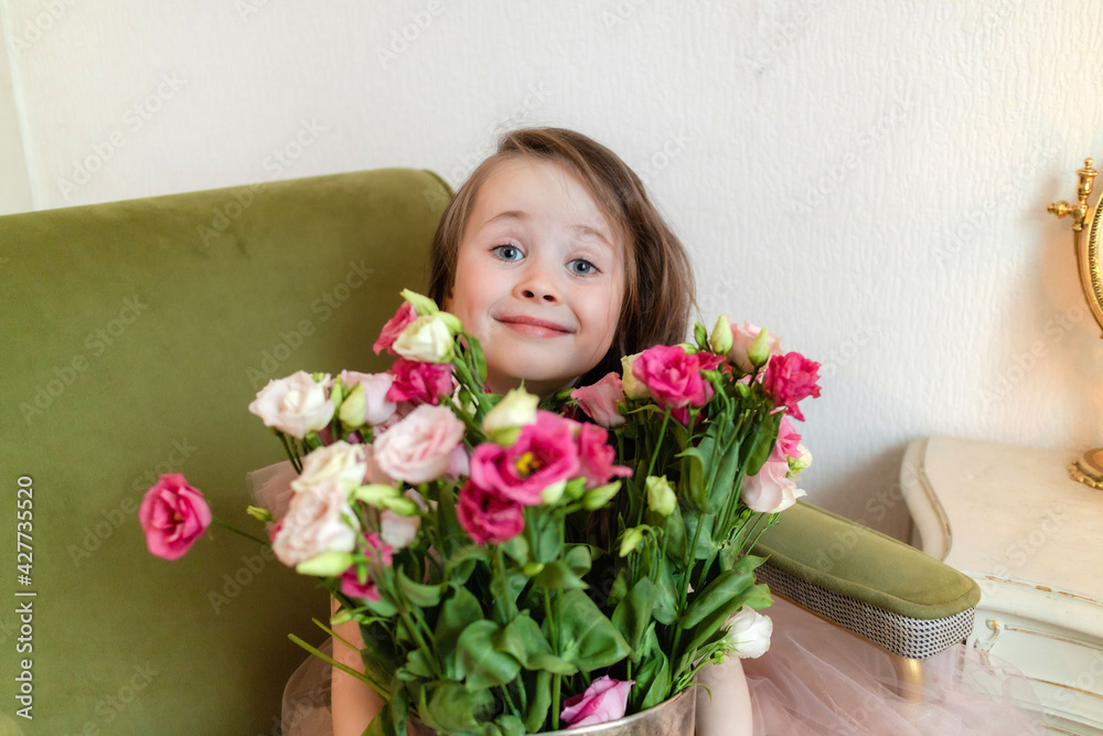 cute little girl in a dress with a bouquet of flowers cute little girl in a dress with a bouquet of flowers