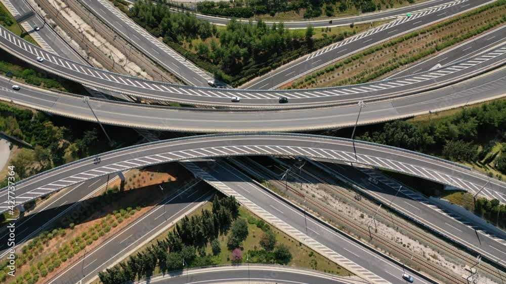 Aerial drone tideo of multilevel highway crossing junction intersection outside urban city center Aerial drone tideo of multilevel highway crossing junction intersection outside urban city center