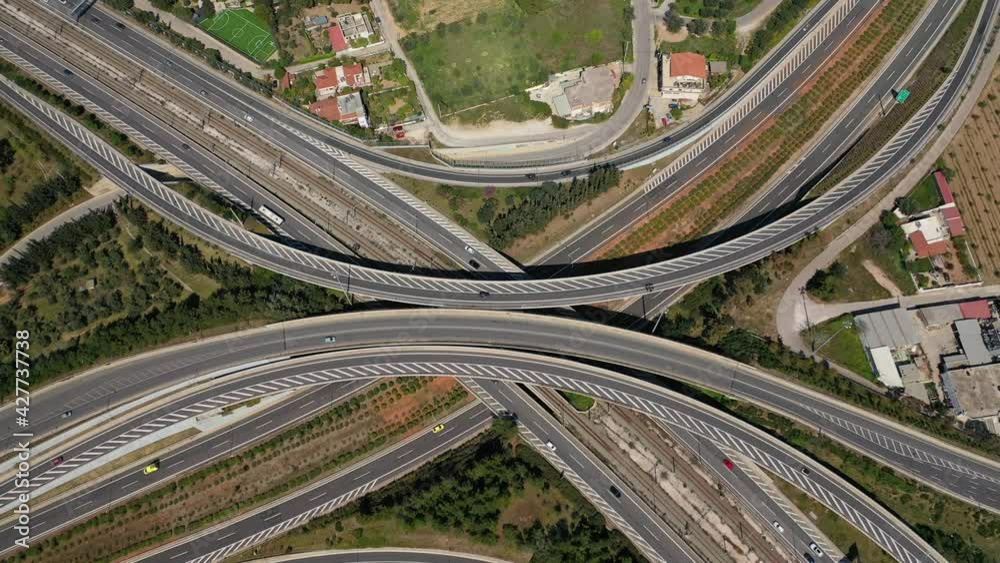 Aerial drone tideo of multilevel highway crossing junction intersection outside urban city center Aerial drone tideo of multilevel highway crossing junction intersection outside urban city center