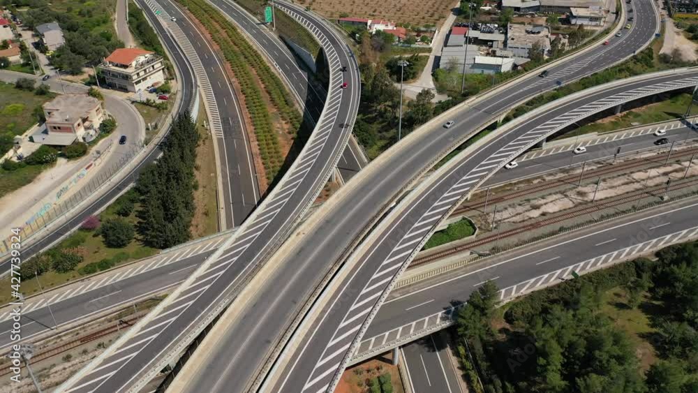 Aerial drone video of multilevel highway junction toll road of Attiki Odos connecting Attica to Athens International Airport of Eleftherios Venizelos, Attica, Greece Aerial drone video of multilevel highway junction toll road of Attiki Odos connecting Attica to Athens International Airport of Eleftherios Venizelos, Attica, Greece