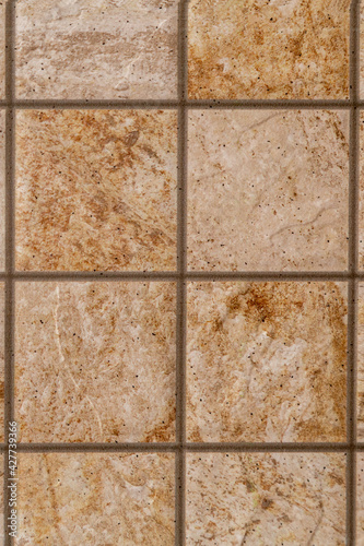 Brown marble stone tiles background, textures with natural pattern, Decorative orange mixed stone mosaic with streaks,floor or wall tile design for interior and exterior, vintage rock, vertical format