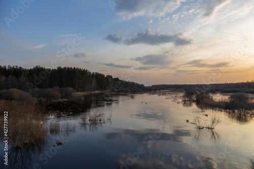 Sunset over the flooded area of the Nerskaya River. © Sergei